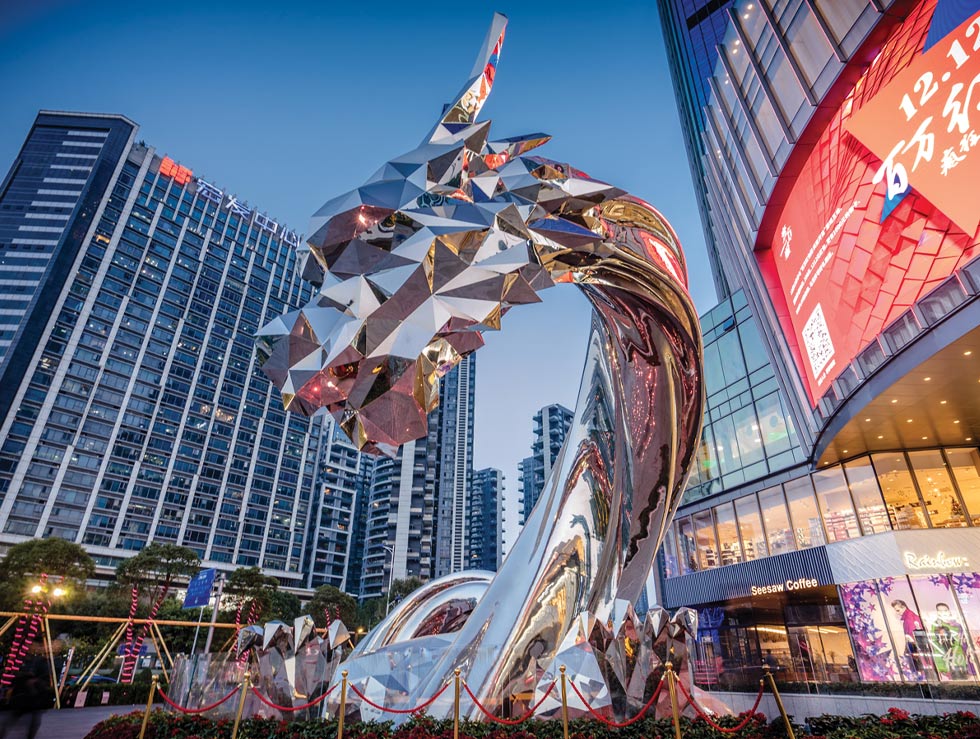 16 meter tall dragon sculpture made from mirror-polished stainless steel
