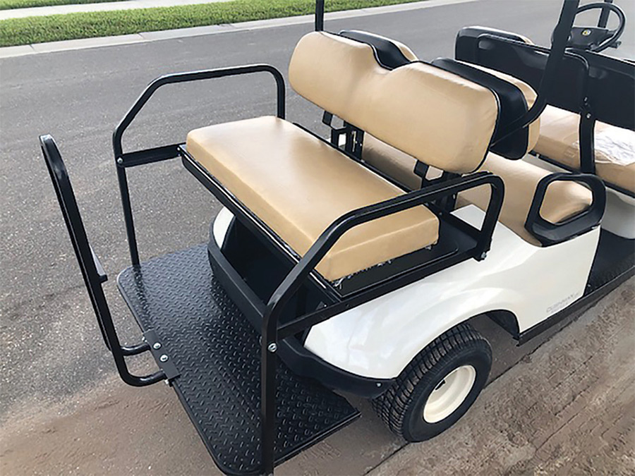 white, tan, and black golf cart