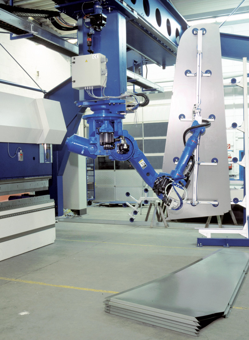A high performance press-tending robot at work