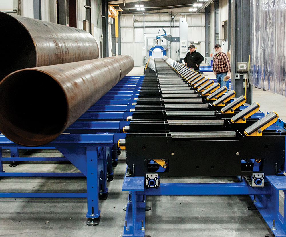 Watts-Mueller’s WM-60 using 180 ft. of conveyors to transport pipe from the outside into the main fabrication shop