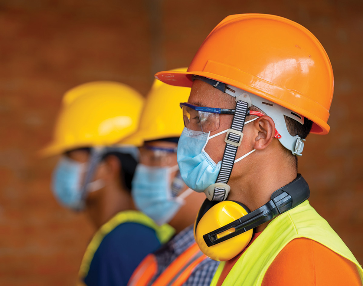 Construction workers wearing face masks