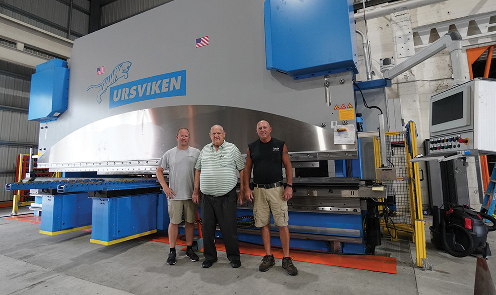 Ryan Taylor, left, Pat Godwin Sr. and Jimmy Tyndall, who designed and built the foundation for the Ursviken