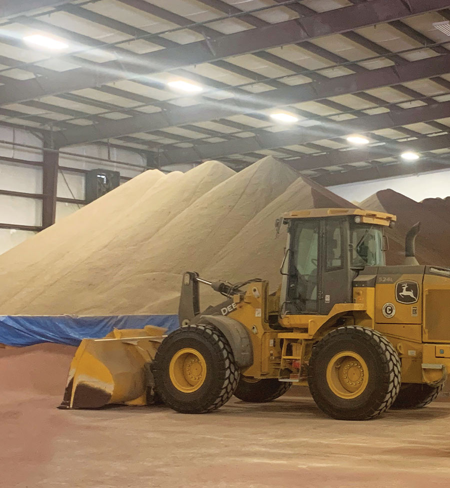 Tractor moving material in a warehouse