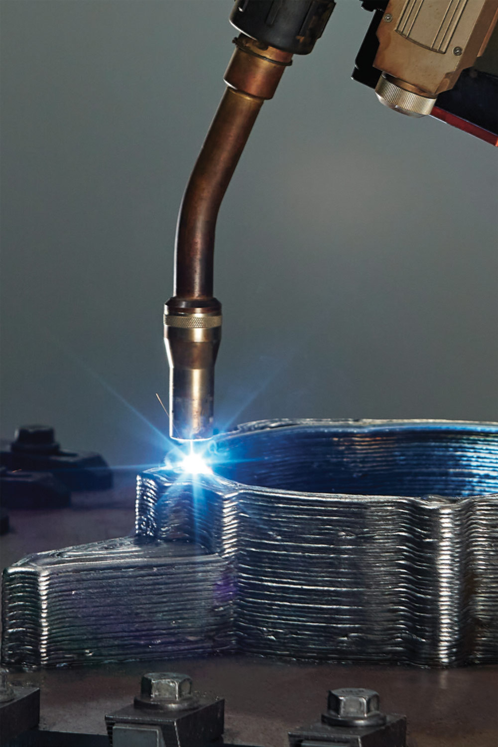 close view of a stack of metal sheets being welded