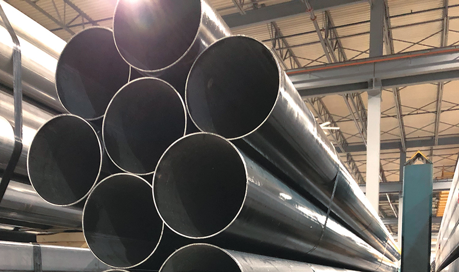 large steel pipes stacked and tied together