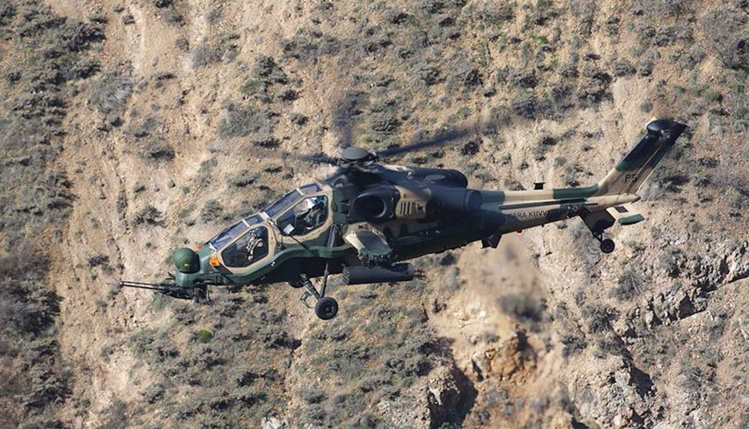an armed forces helicopter in mid-flight