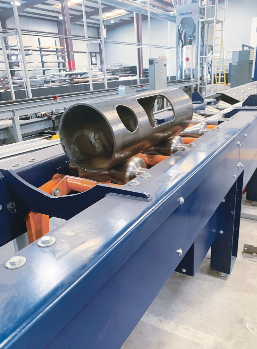 metal tubes being manufactured